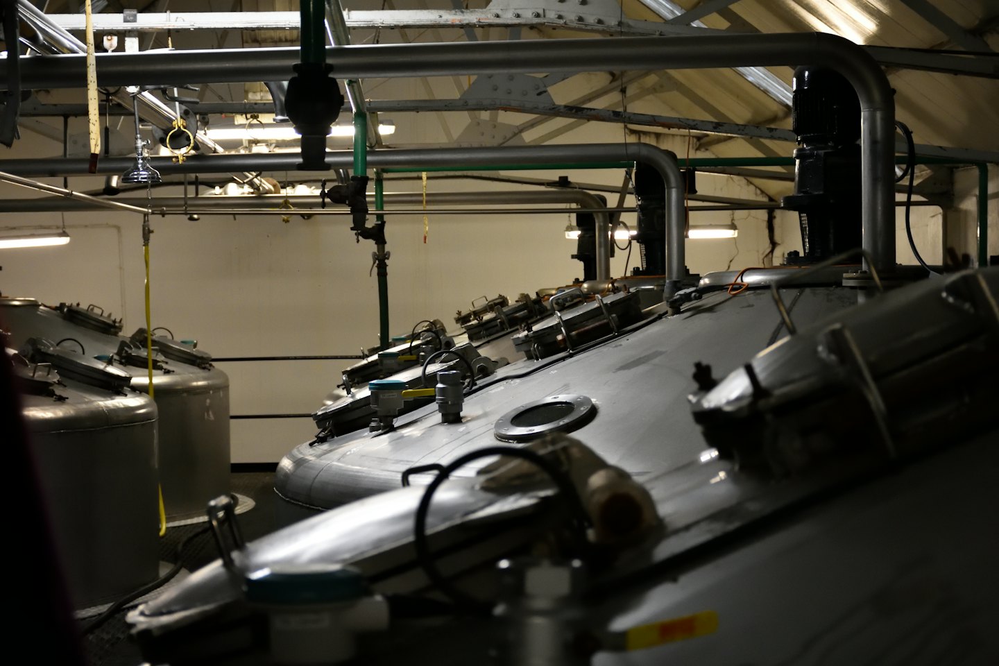 Stainless steel tanks and pipes in a brewery.